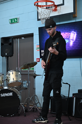 Student playing bass guitar